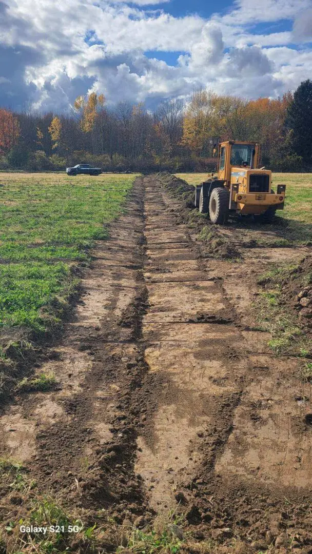 Tractor working on a dirt path construction.